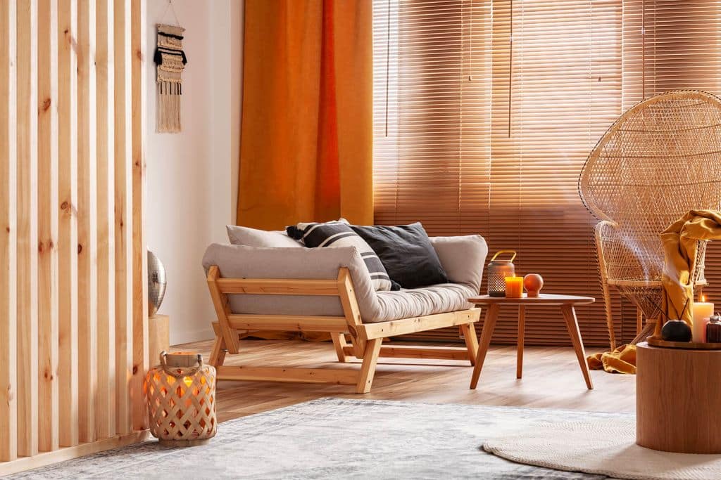 Living room designed according to sensory design principles with natural light, textured materials, and neutral-toned furnishings